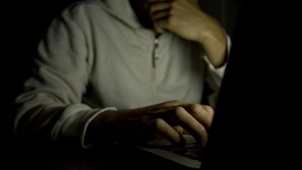 person on computer